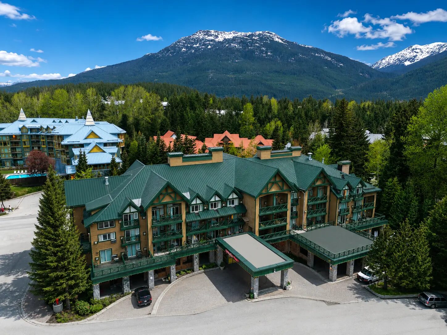 Aerial view of Pinnacle Hotel Whistler Village and the Coast Mountains in Whistler Village